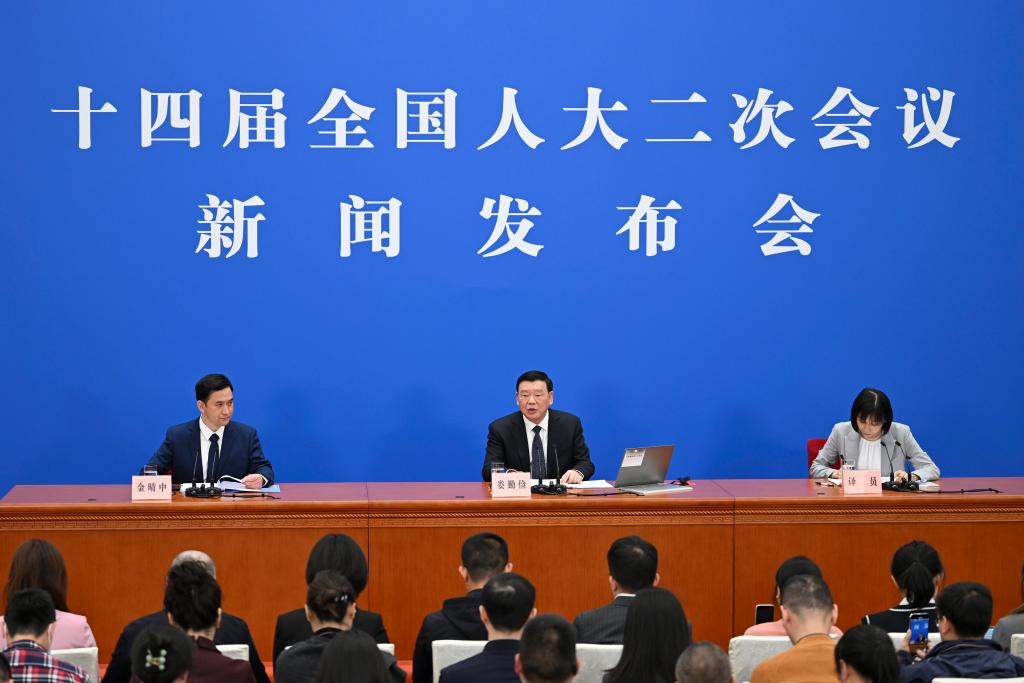 3月4日，十四屆全國人大二次會議在北京人民大會堂舉行新聞發(fā)布會。大會發(fā)言人婁勤儉就大會議程和人大工作相關(guān)問題回答中外記者的提問。 新華社記者 牟宇 攝