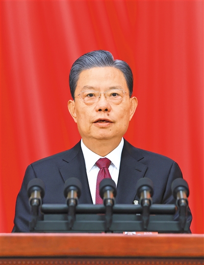 3月8日，十四屆全國人大二次會議在北京人民大會堂舉行第二次全體會議。受全國人大常委會委托，趙樂際委員長向大會報告全國人大常委會工作。 　　新華社記者 王 曄攝