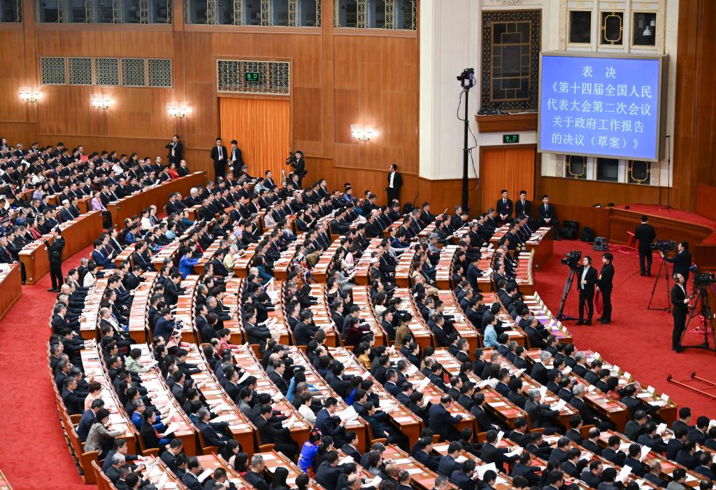 3月11日，第十四屆全國人民代表大會第二次會議在北京人民大會堂舉行閉幕會。新華社記者 牟宇 攝